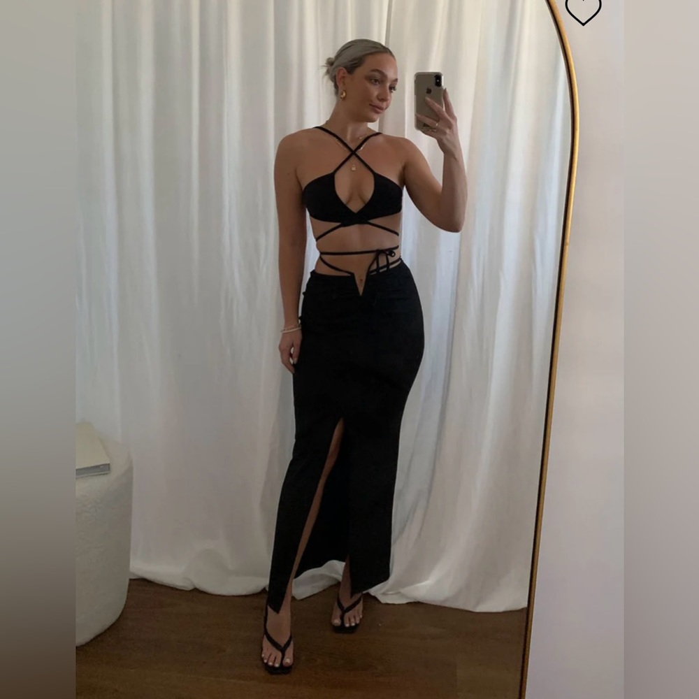 Two piece black strappy skirt and top